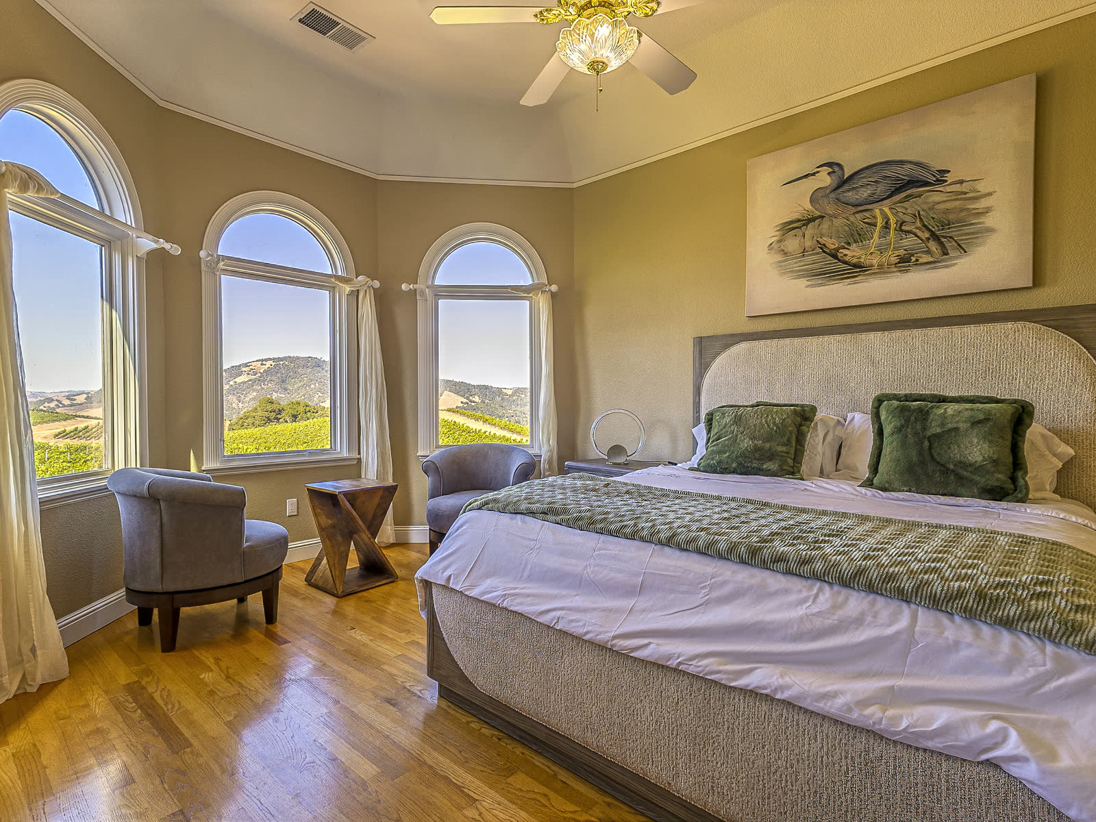 Bedroom two, under its three arched windows