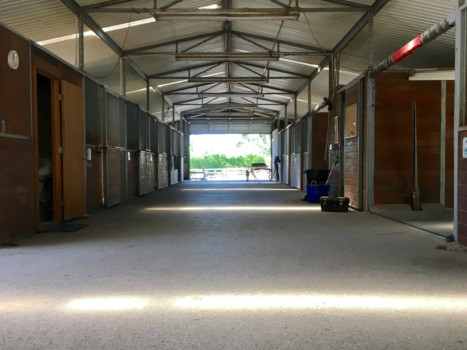 The barn aisle, looking out to daylight