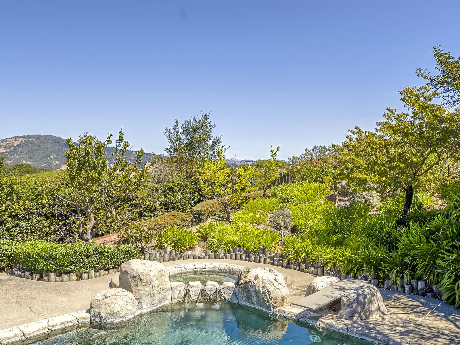 The spa, set into the rock beside the pool